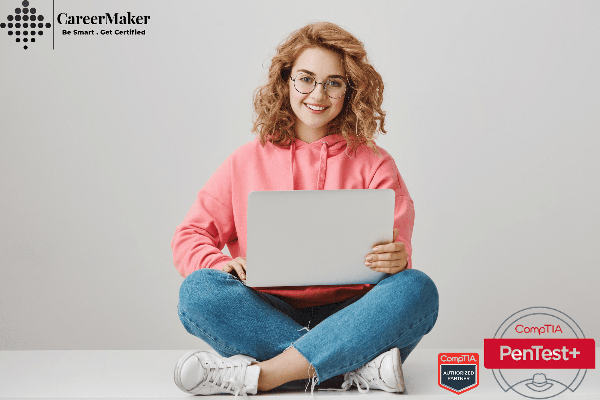 Woman working on a laptop with CompTIA PenTest+ Certification , Career Maker logo